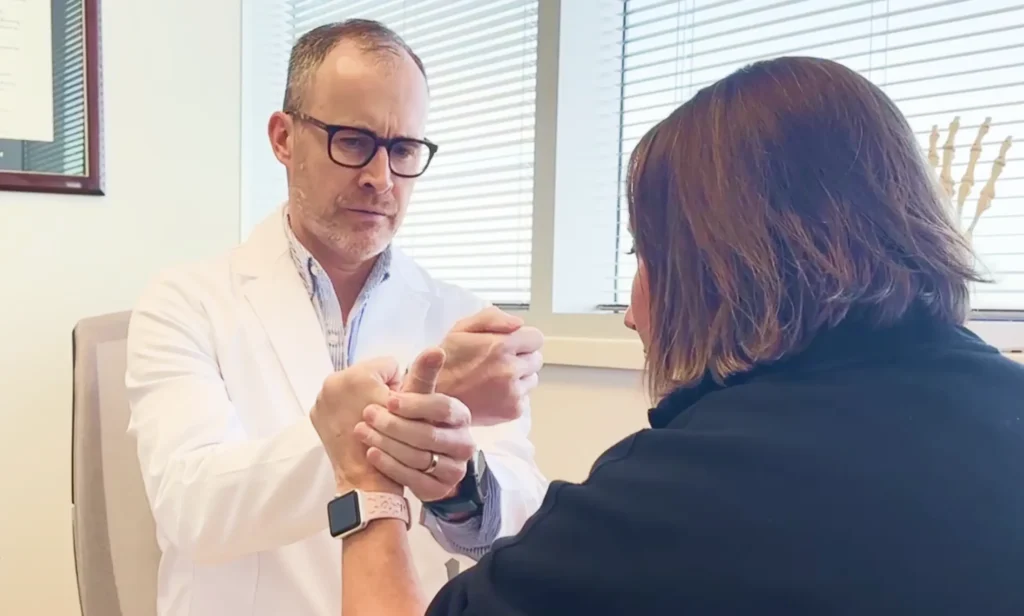 Physician holding patients wrist
